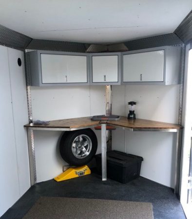 White Sportsman II overhead cabinets in V-nose trailer