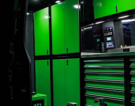 Green ProII Series Cabinets with Black Frames in Motocross Van