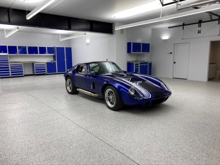 Sportscar in a garage with Blue Moduline Cabinets