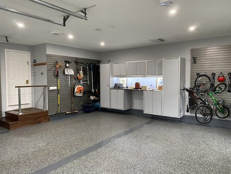 Home Garage with Wall-Mounted Moduline Workbench and Storage