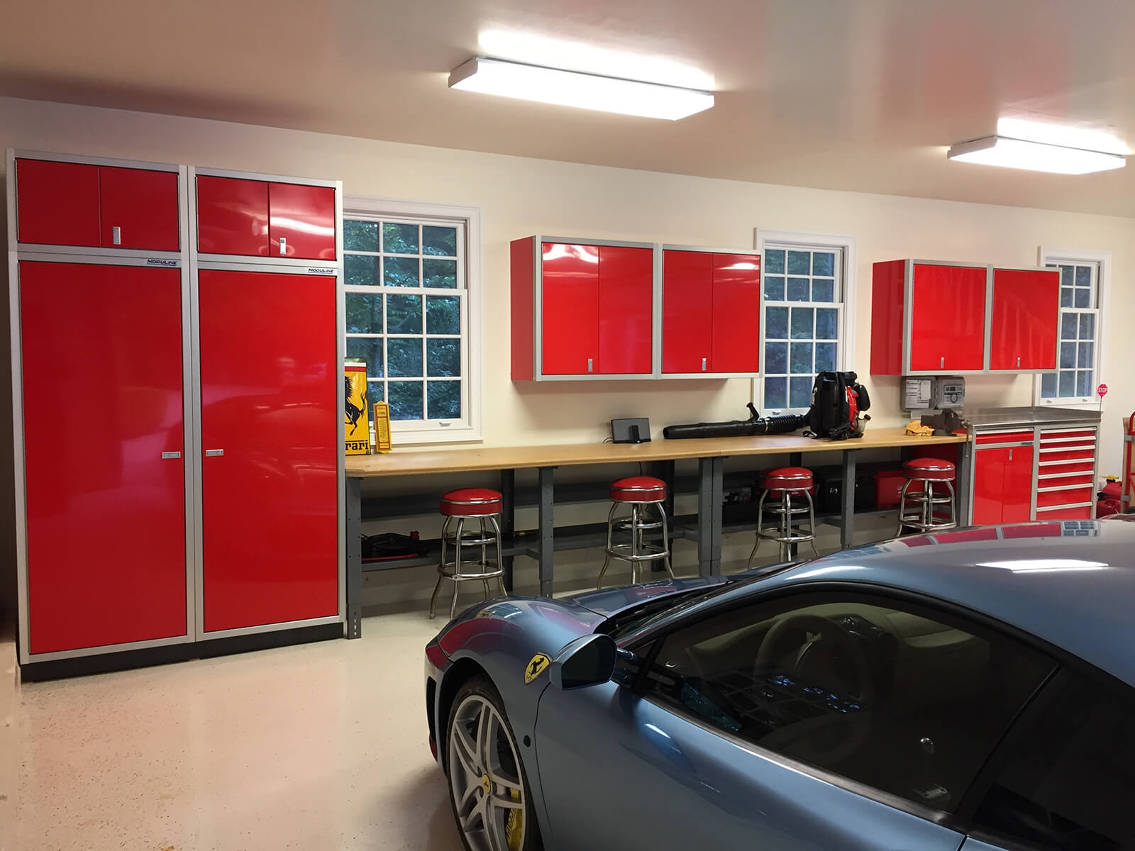 Ferrari Garage with Red Moduline Cabinets