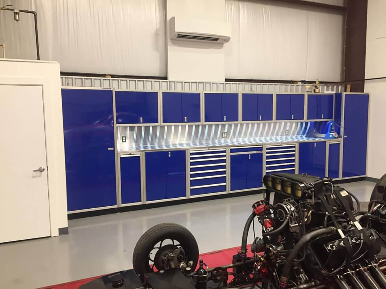 Professional Race Garage with Moduline Blue Cabinets