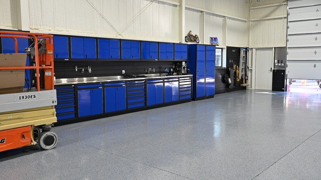 Moduline Blue Cabinets with Black Anodize frames in a commercial garage