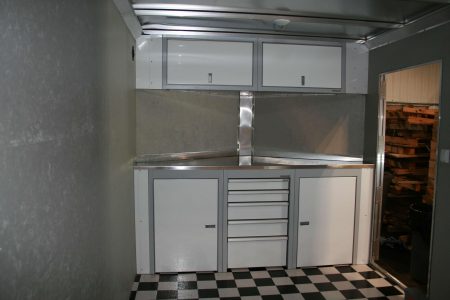 White Cabinets in V-nose trailer with checkerboard floor